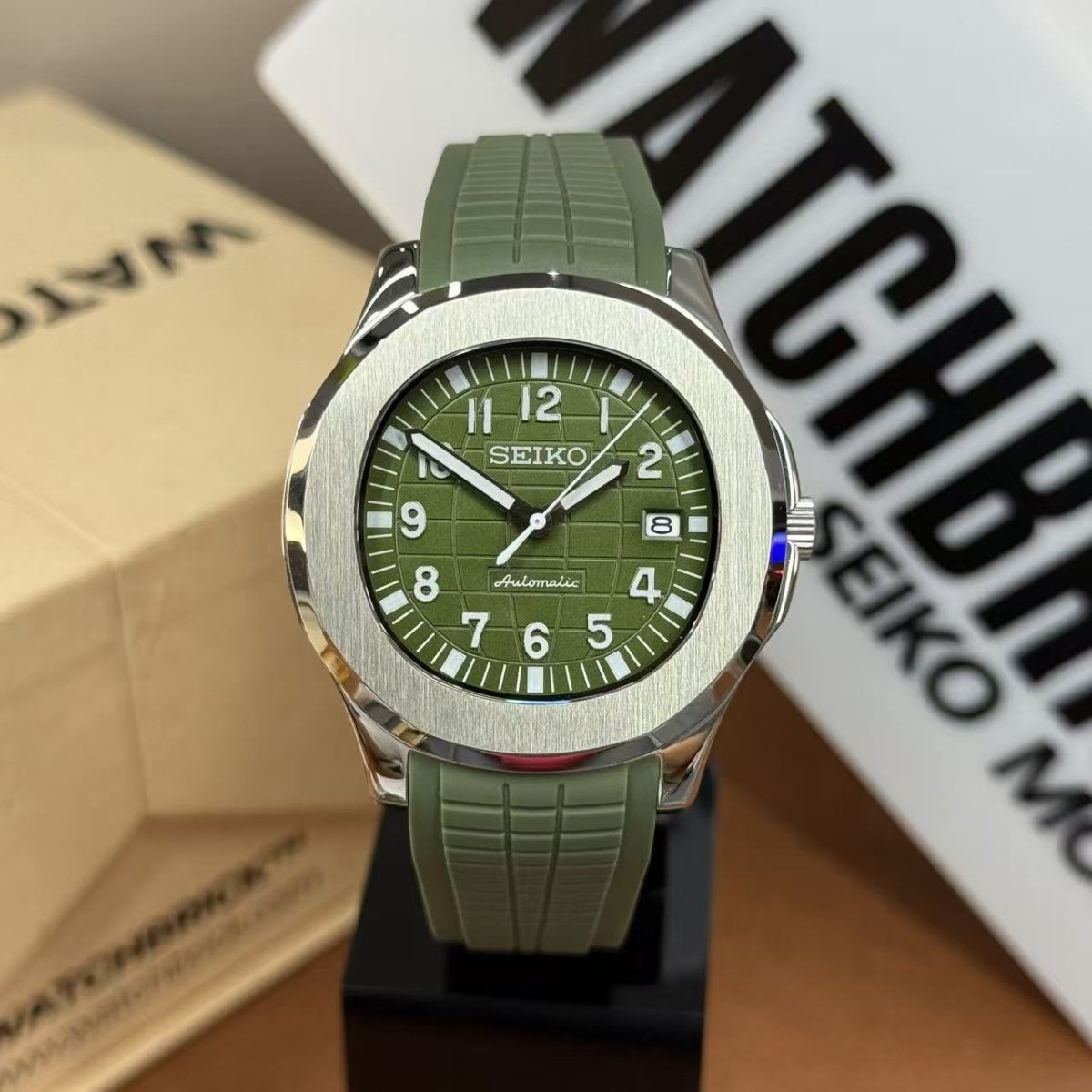 Green Seiko mod watch with NH35 automatic movement, jungle green dial and rubber strap