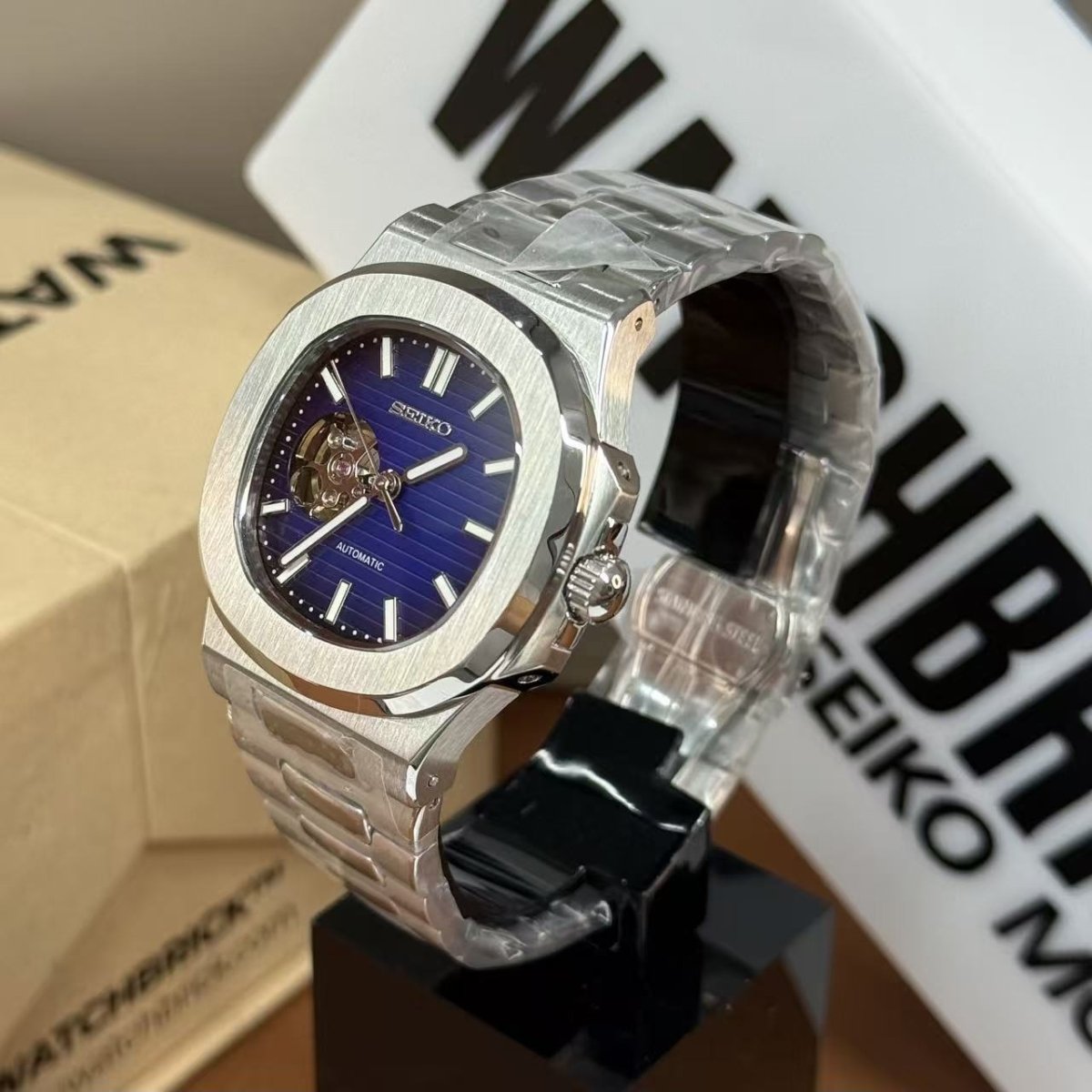 Seiko mod automatic watch with open-heart dark blue dial and stainless steel bracelet