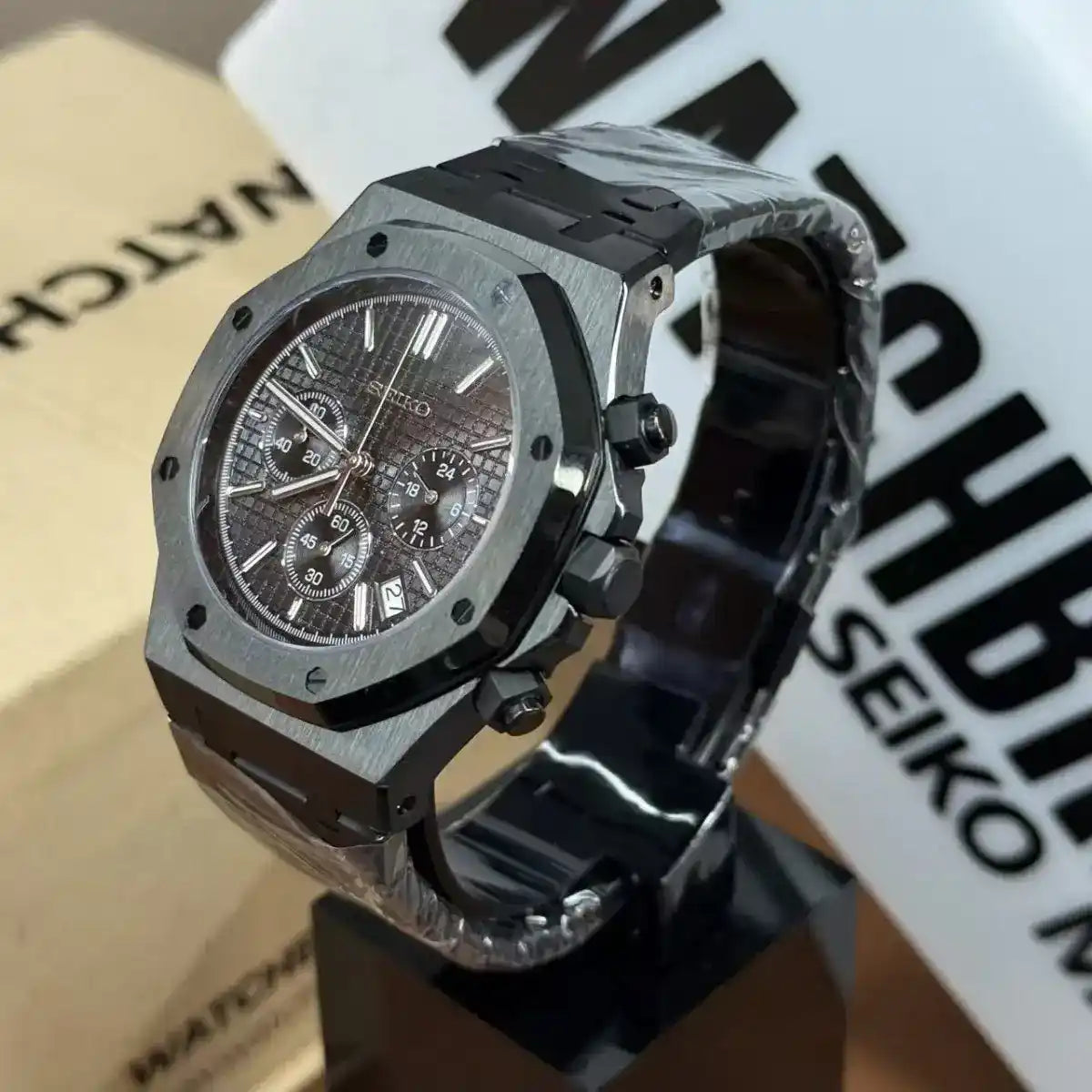 All-black Seiko mod chronograph watch with textured dial and stainless steel case