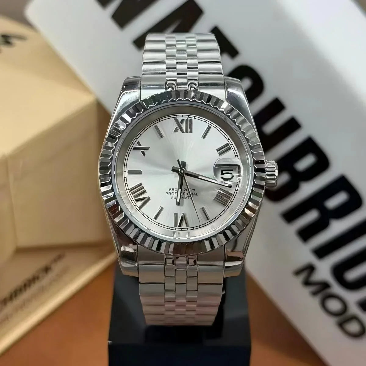 Silver Seiko mod watch with Roman numerals, date window, and stainless steel bracelet