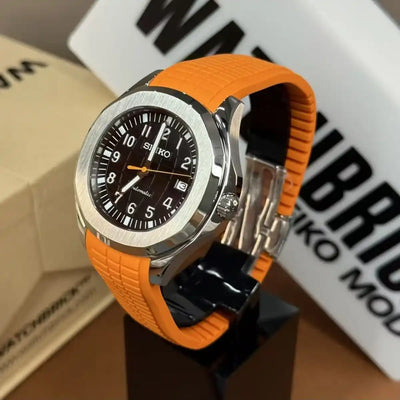 Seiko mod watch with orange rubber strap, black dial, silver bezel, and date display