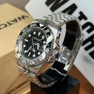 Stainless steel Seiko mod watch with black bezel and black dial on display stand