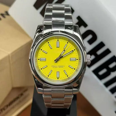 Stainless steel wristwatch with bright yellow dial and luminous markers, close-up view